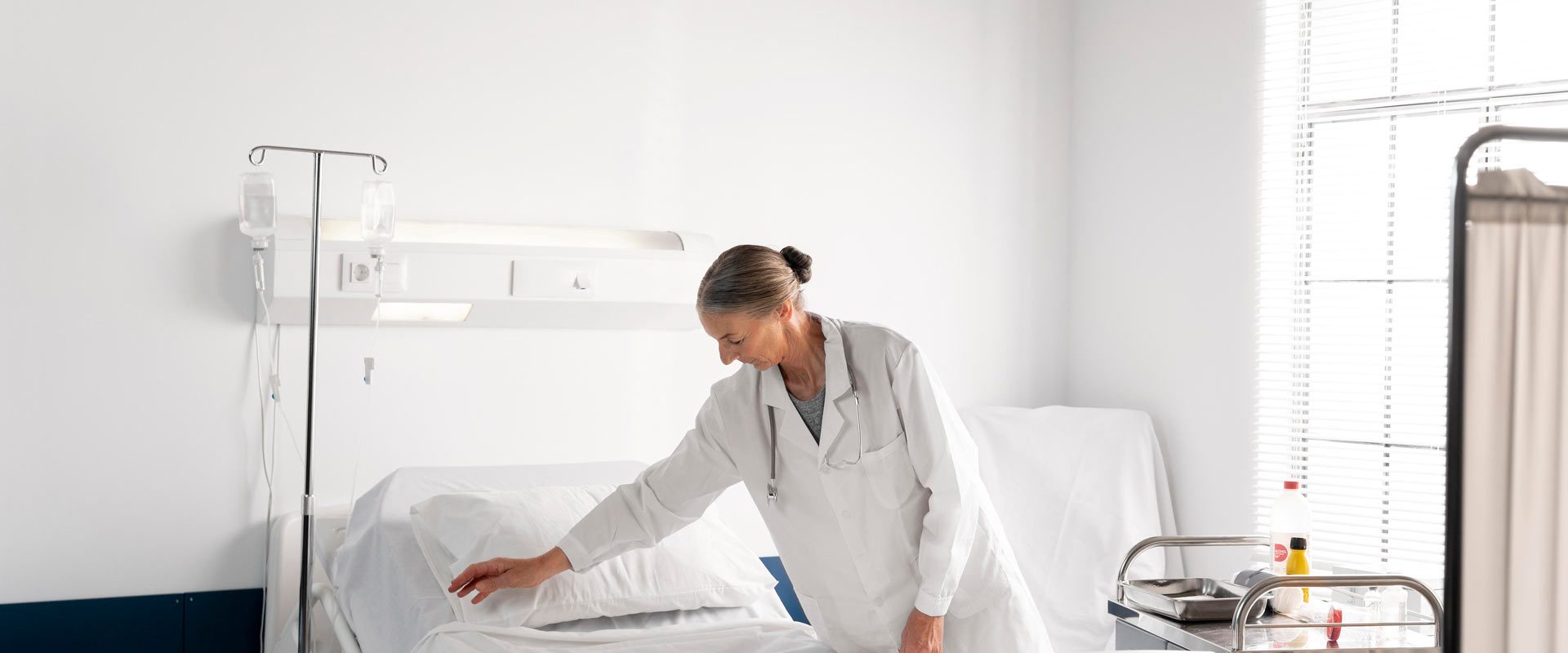 medium-shot-doctor-checking-patient-bed-banner-2